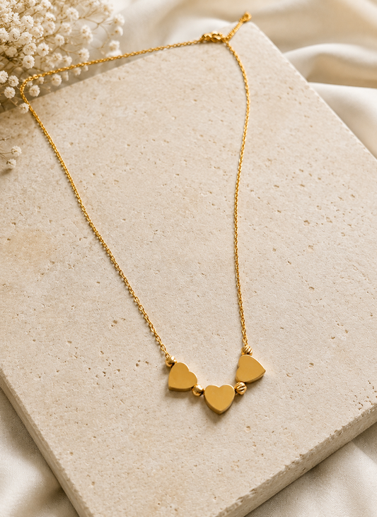 Triple golden hearts necklace