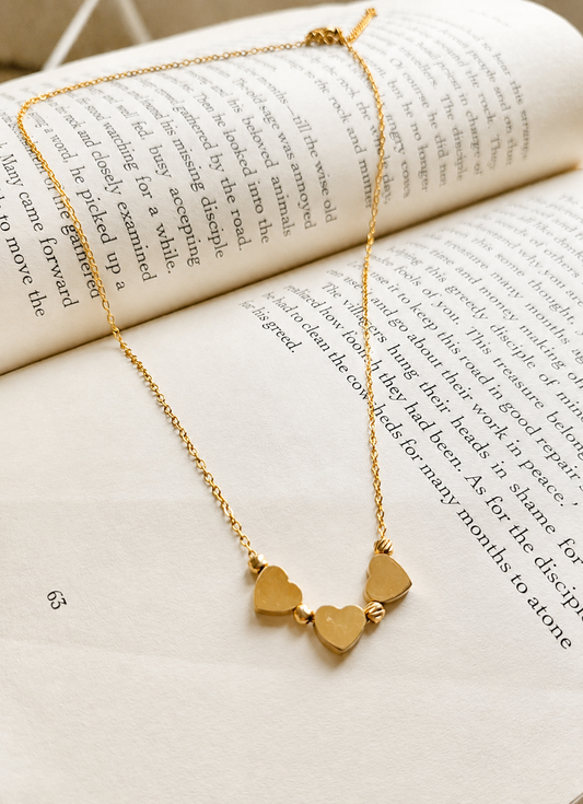 Triple golden hearts necklace